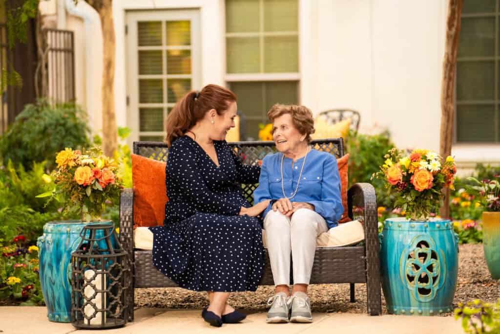 two ladies sitting on a bench