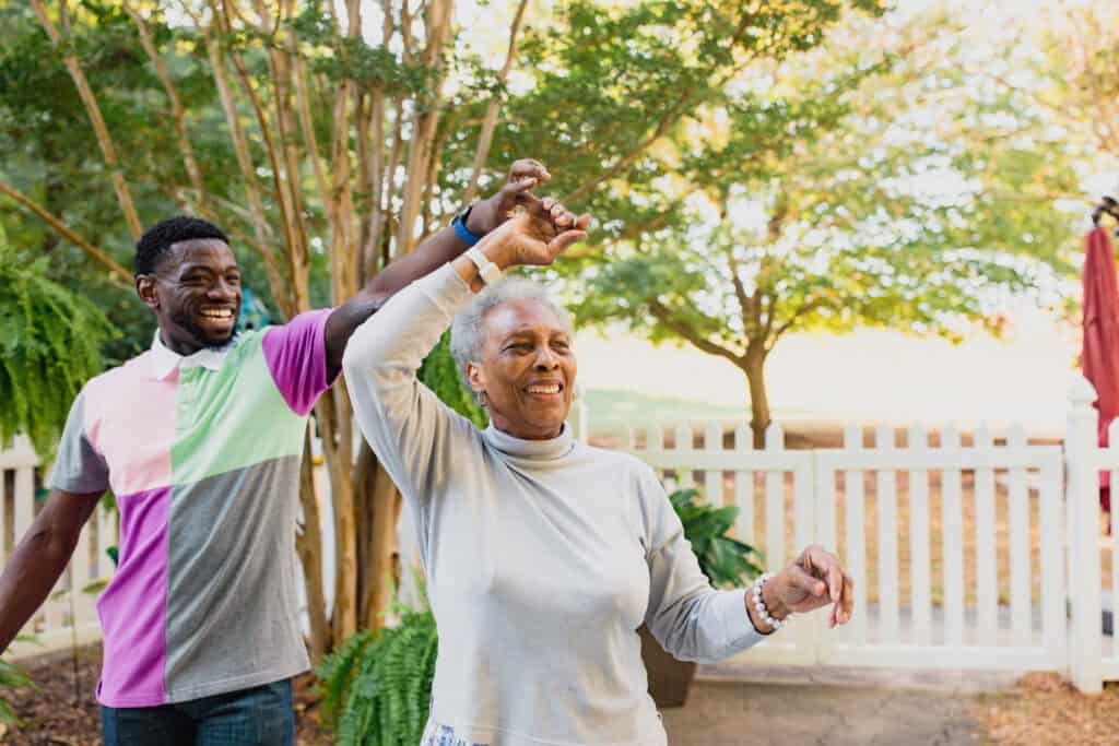young man dancing with older woman