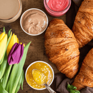 Tray with breakfast items and flowers