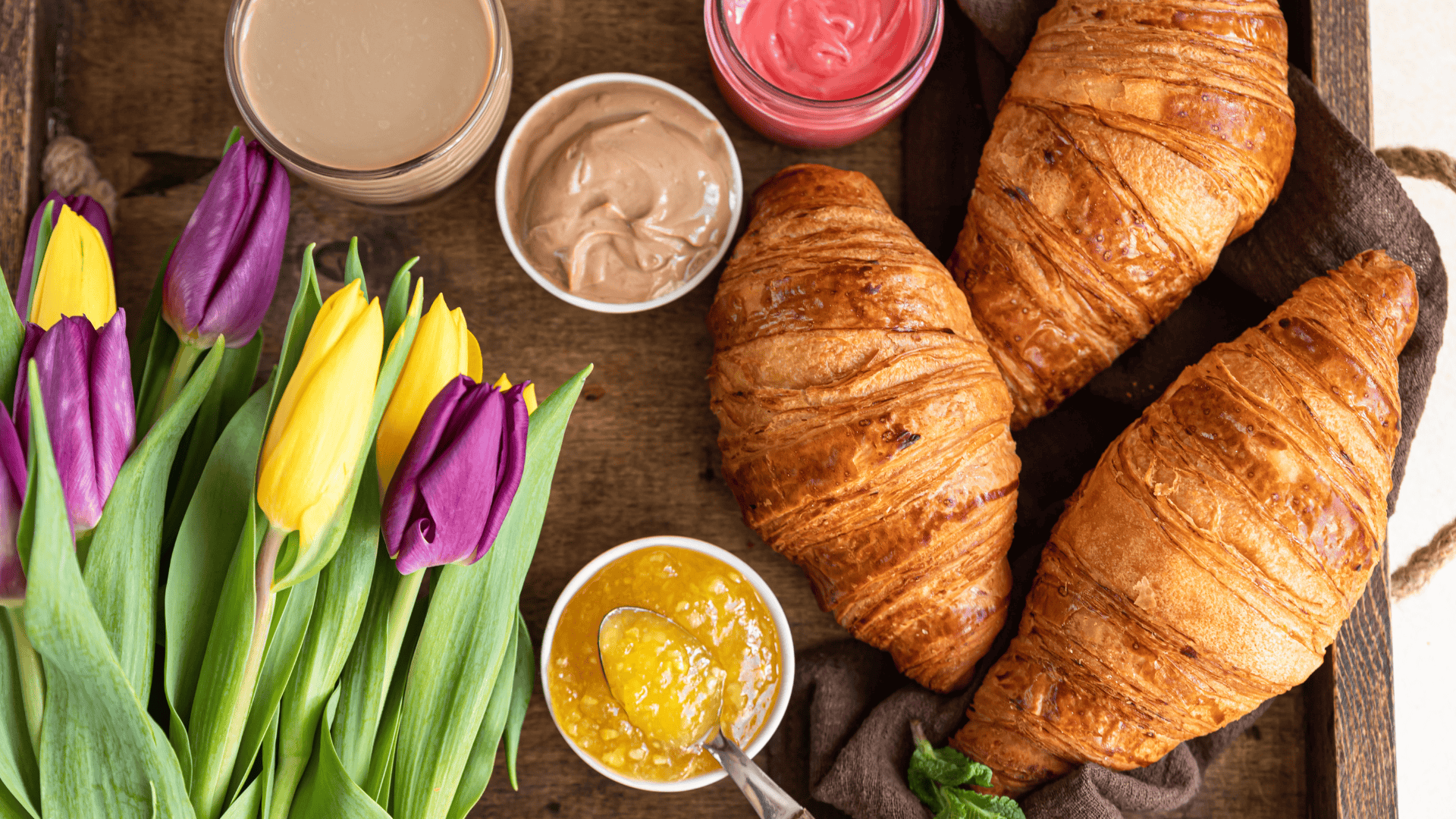 Tray with breakfast items and flowers