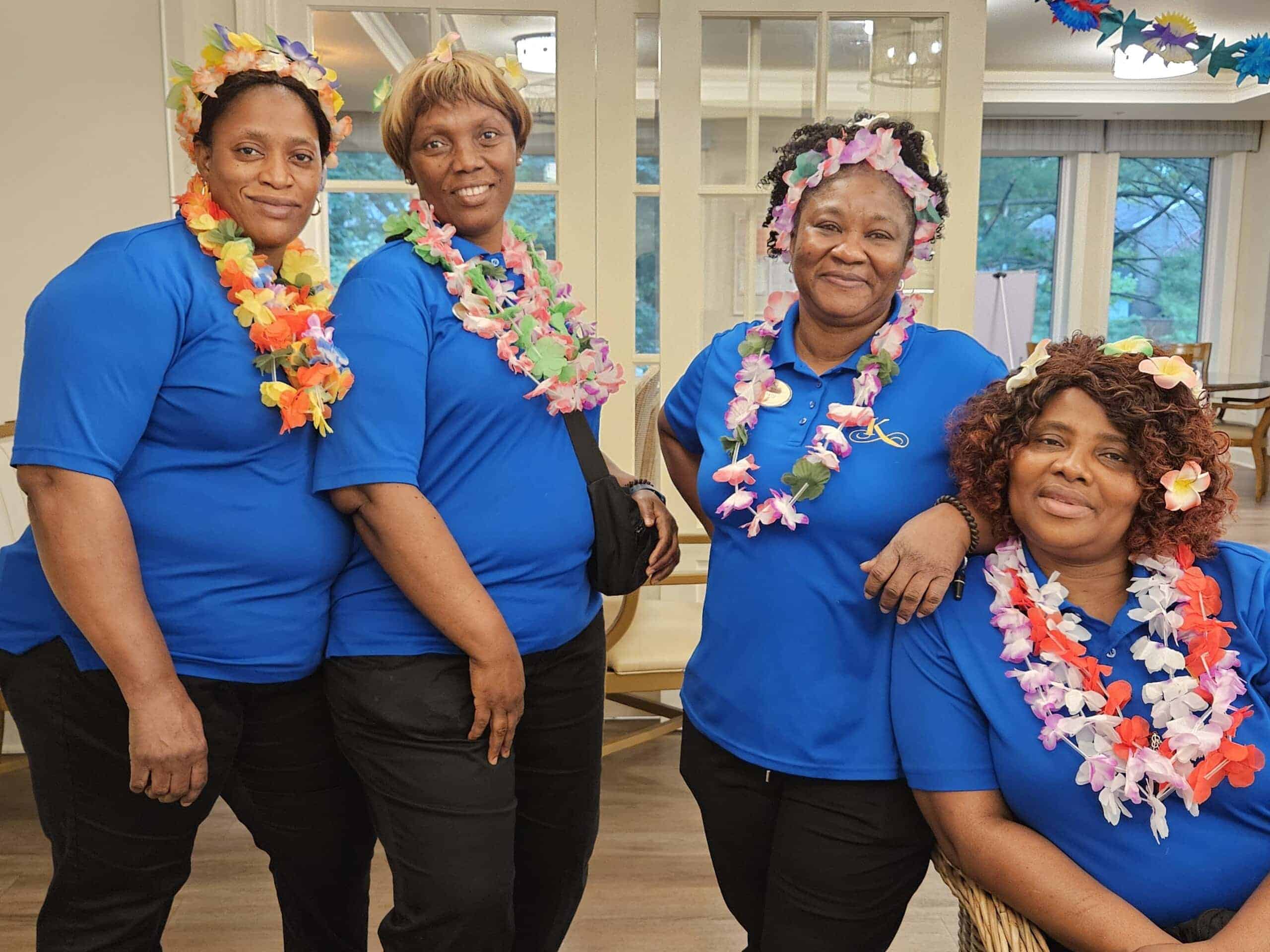team members wearing luau leis