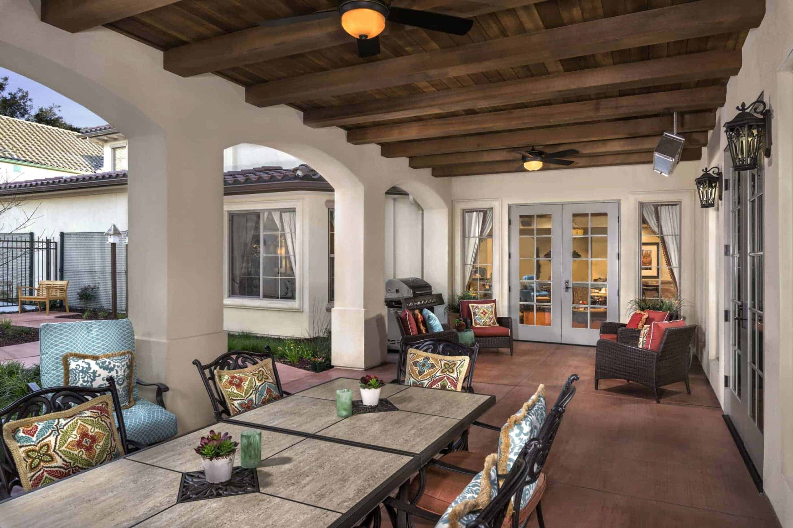 outdoor patio space with grill and seating