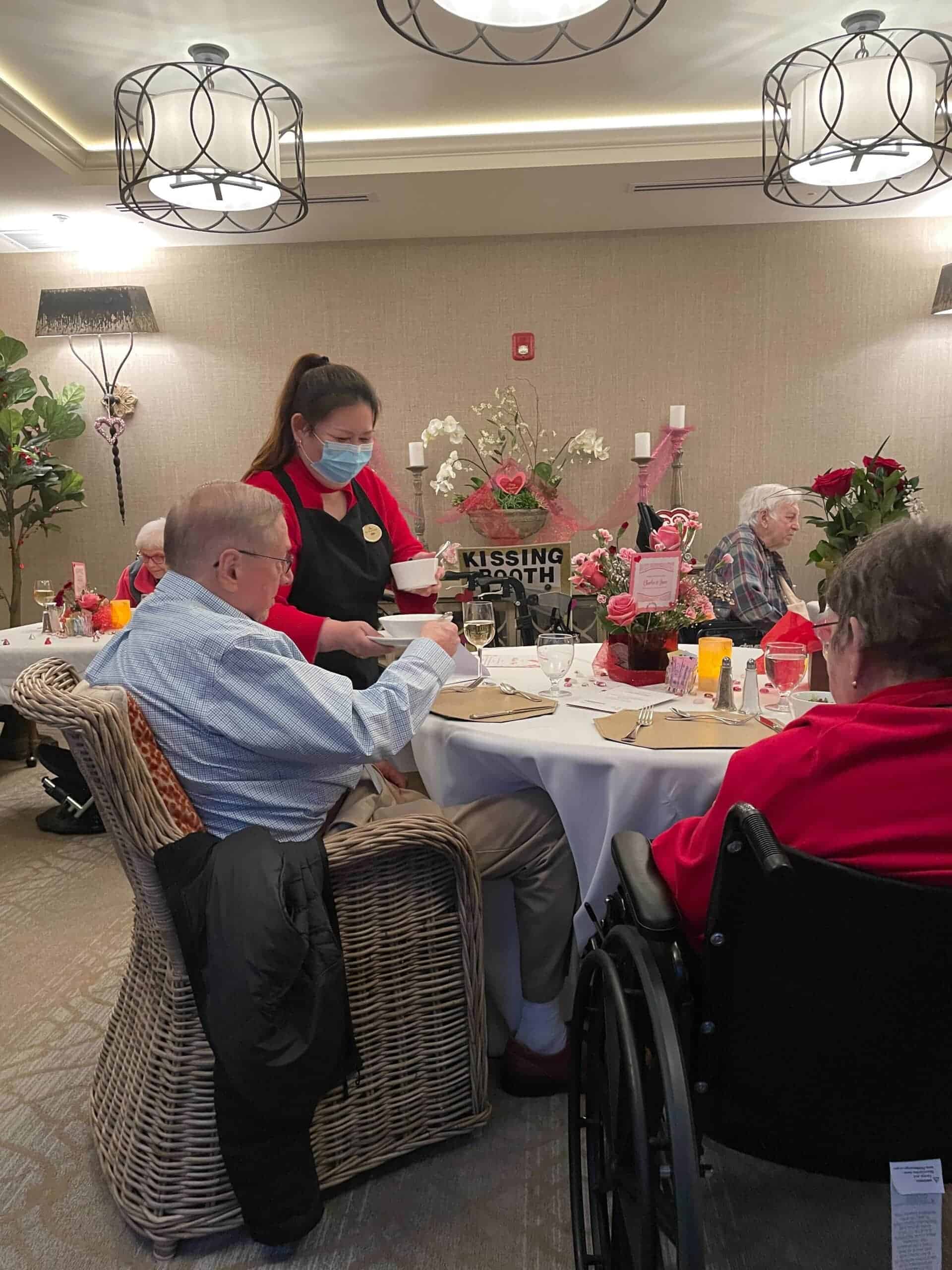 dining team serving residents dinner