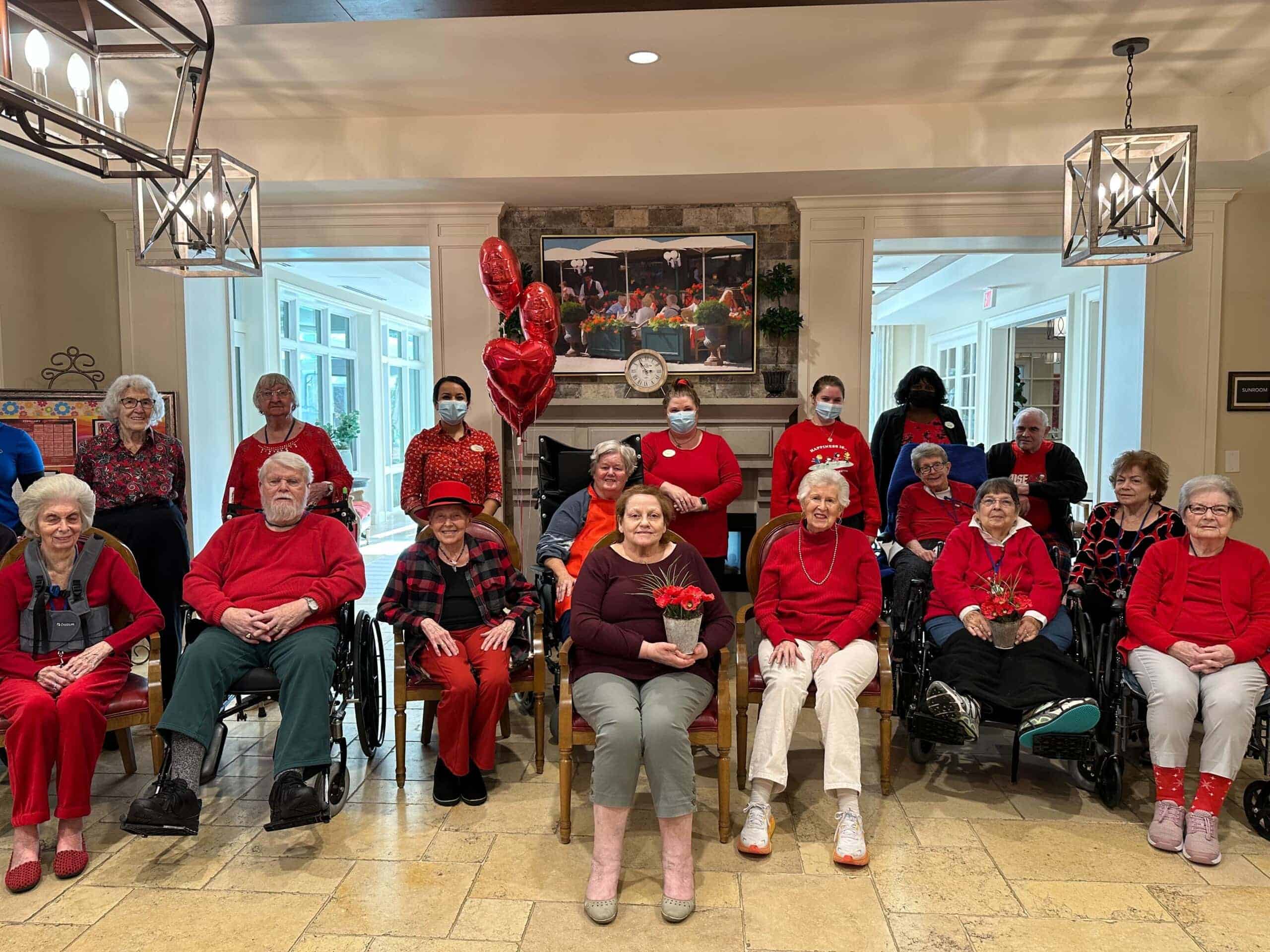 care team and residents dressed in red for Valentine's Day