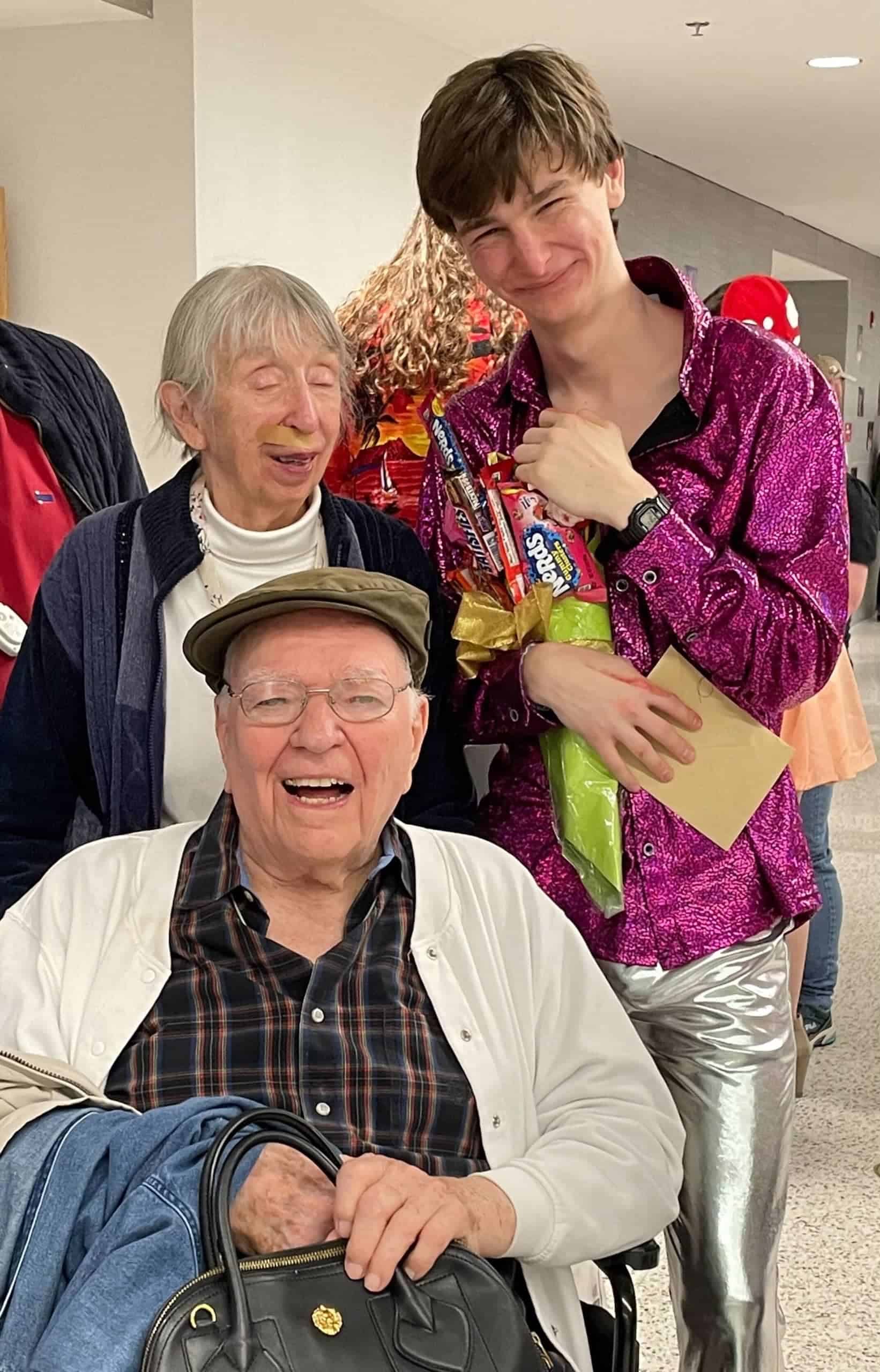 elderly residents and young man at event