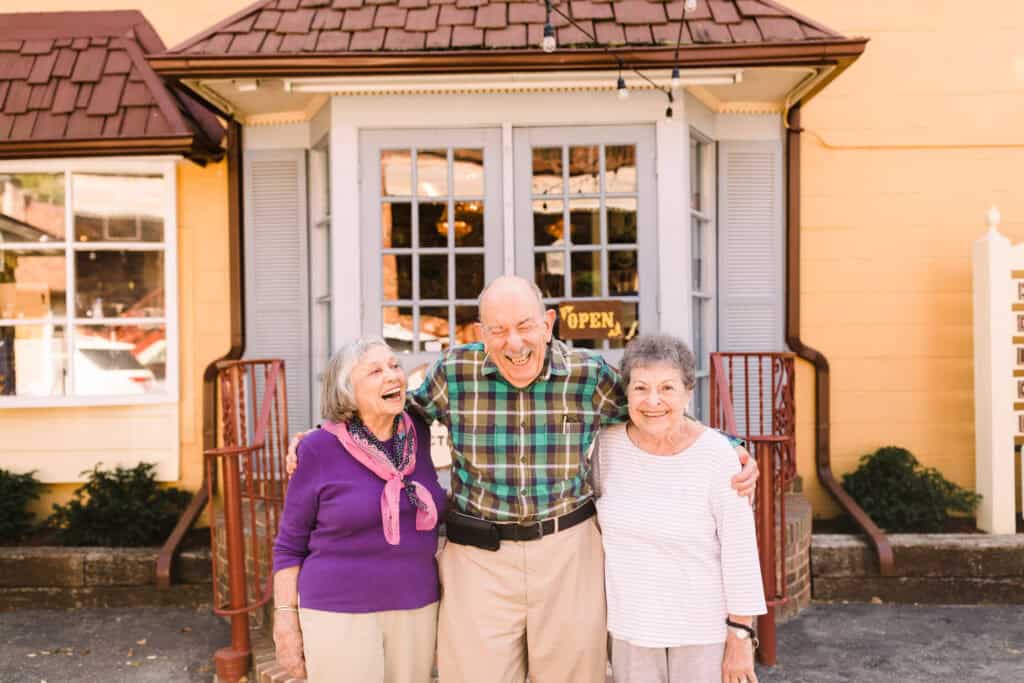 older men and women posing for photo